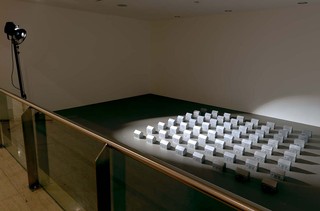 Aleks Danko, Australia b.1950 / DAY IN DAY OUT (second version) 1991 / Cast aluminium and theatre light on metal support / 11 x 260 x 229cm / Purchased 1992 / Collection: Queensland Art Gallery / © Queensland Art Gallery / Photograph: Natasha Harth © QAGOMA