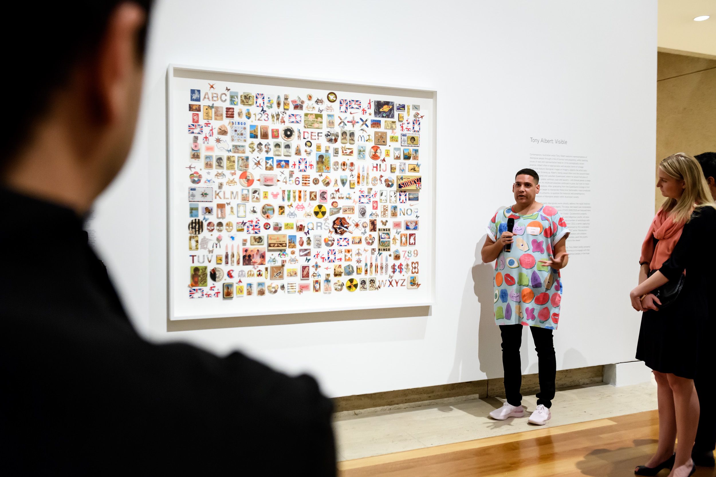 Artist Tony Albert with his work Moving the line 2018, commissioned with funds from the Future Collective, during the Future Collective Preview of ‘Tony Albert: Visible’ at Queensland Art Gallery, May 2018 / Photograph: Chloë Callistemon