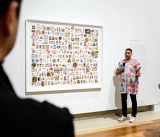Artist Tony Albert with his work Moving the line 2018, commissioned with funds from the Future Collective, during the Future Collective Preview of ‘Tony Albert: Visible’ at Queensland Art Gallery, May 2018 / Photograph: Chloë Callistemon