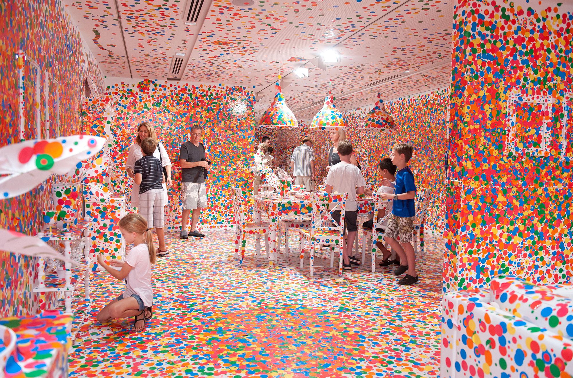 Yayoi Kusama, Japan b.1929 / The obliteration room 2002-present / Furniture, white paint, dot stickers / Collaboration between Yayoi Kusama and Queensland Art Gallery. Commissioned Queensland Art Gallery. Gift of the artist through the QAG Foundation 2012 / Collection: Queensland Art Gallery | Gallery of Modern Art / © Yayoi Kusama / Photograph M Sherwood © QAGOMA
