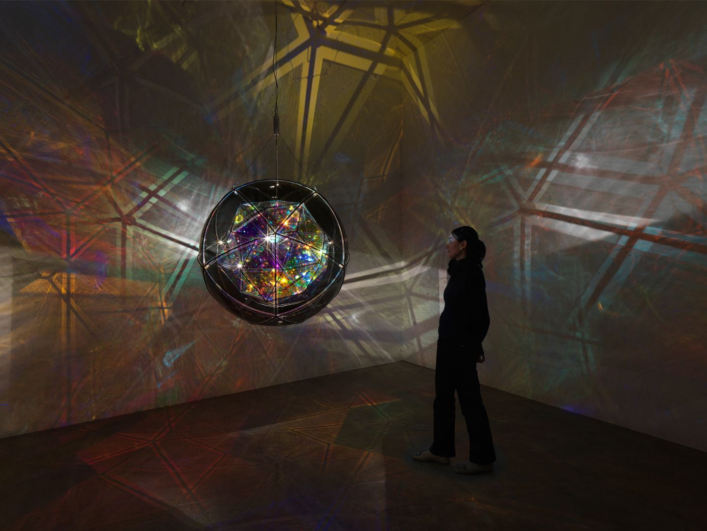 Olafur Eliasson, Denmark b.1967 | Firefly city 2025 | Coloured glass (grey), coloured glass with semi-transparent mirror filter, colour-effect filter glass (red, blue, cyan, magenta, pink, orange), LED lights, aluminium, stainless steel, paint (black), wire, motor, ballast | Installation view: Studio Olafur Eliasson, Berlin | © 2025 Olafur Eliasson | Photograph: Jens Ziehe