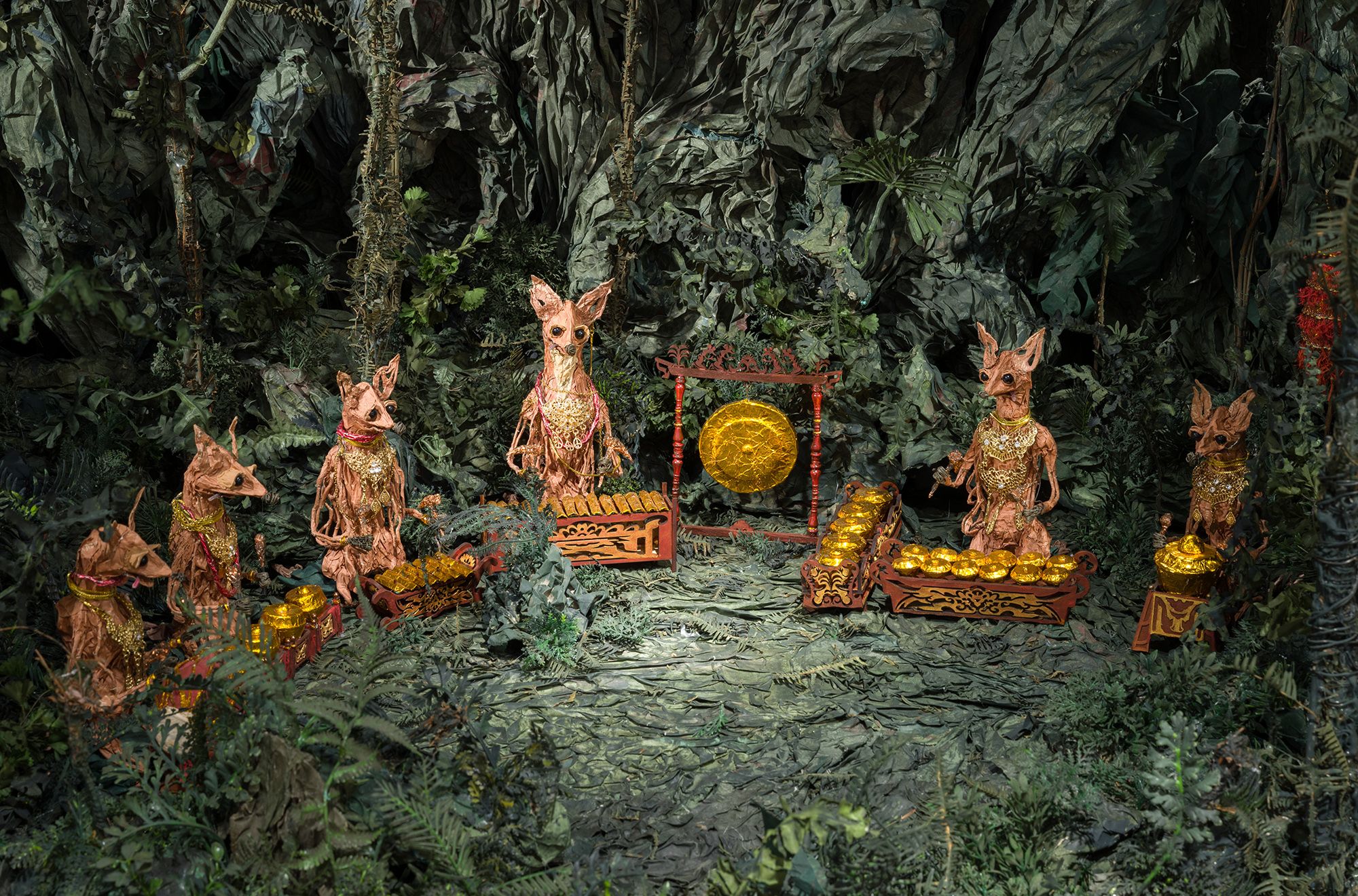 Zhang Xu Zhan, Taiwan b.1988 / Compound eyes of tropical 2020-22 (detail) 2024 / Single-channel 4K video installation: colour, sound, 16 minutes, ed. 6/6; wire, newspaper, glazed paper, paste, plastic beads, accessories 5 puppets: 23 × 18 × 18.5cm; 24 × 10.5 × 24cm; 26 × 12 × 18.5cm; 21.5 × 10 × 21cm; 20.5 × 9.5 × 13; 5 bases: 3 × 38 × 42cm (each) / Purchased 2024. QAGOMA Foundation / Collection: Queensland Art Gallery | Gallery of Modern Art / Courtesy: ZHAN ZHAN XI QI studio / © Zhang Xu Zhan / Photograph: C Callistemon © QAGOMA