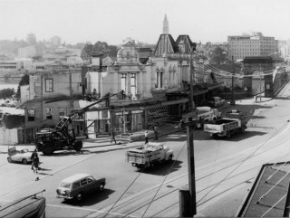 A crane works on demolition of buildings in Melbourne Street in preparation for the new Victoria Bridge, September 1966 / 188208 / Courtesy: State Library of Queensland