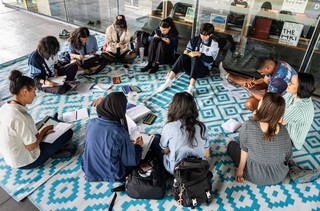 Students from Mabel Park State High write letters as part of their workshop at QAGOMA, March 2025 / Photograph: Louis Lim