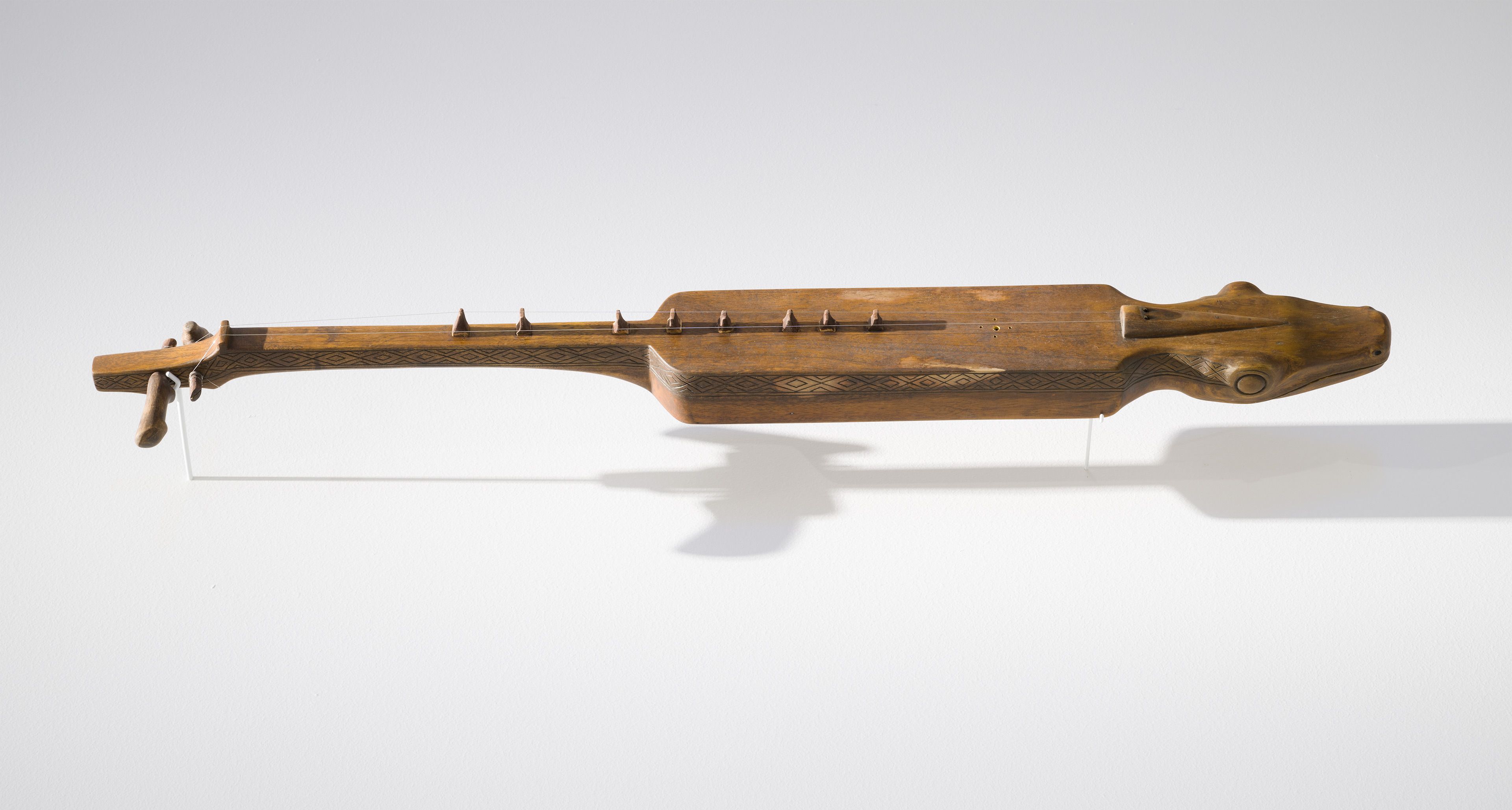 Chong Tecson / Talaandig people / The Philippines b.1994 / Lives and works in Songco, The Philippines / Kudlong (Boat lute) 2024 / Carved wood / Purchased 2024 with funds from the Bequest of Noela Clare Deutscher, in memory of her parents, A. Evans Deutscher and Clare Deutscher, through the Queensland Art Gallery | Gallery of Modern Art Foundation / © Chong Tecson / Photograph: C Callistemon, QAGOMA