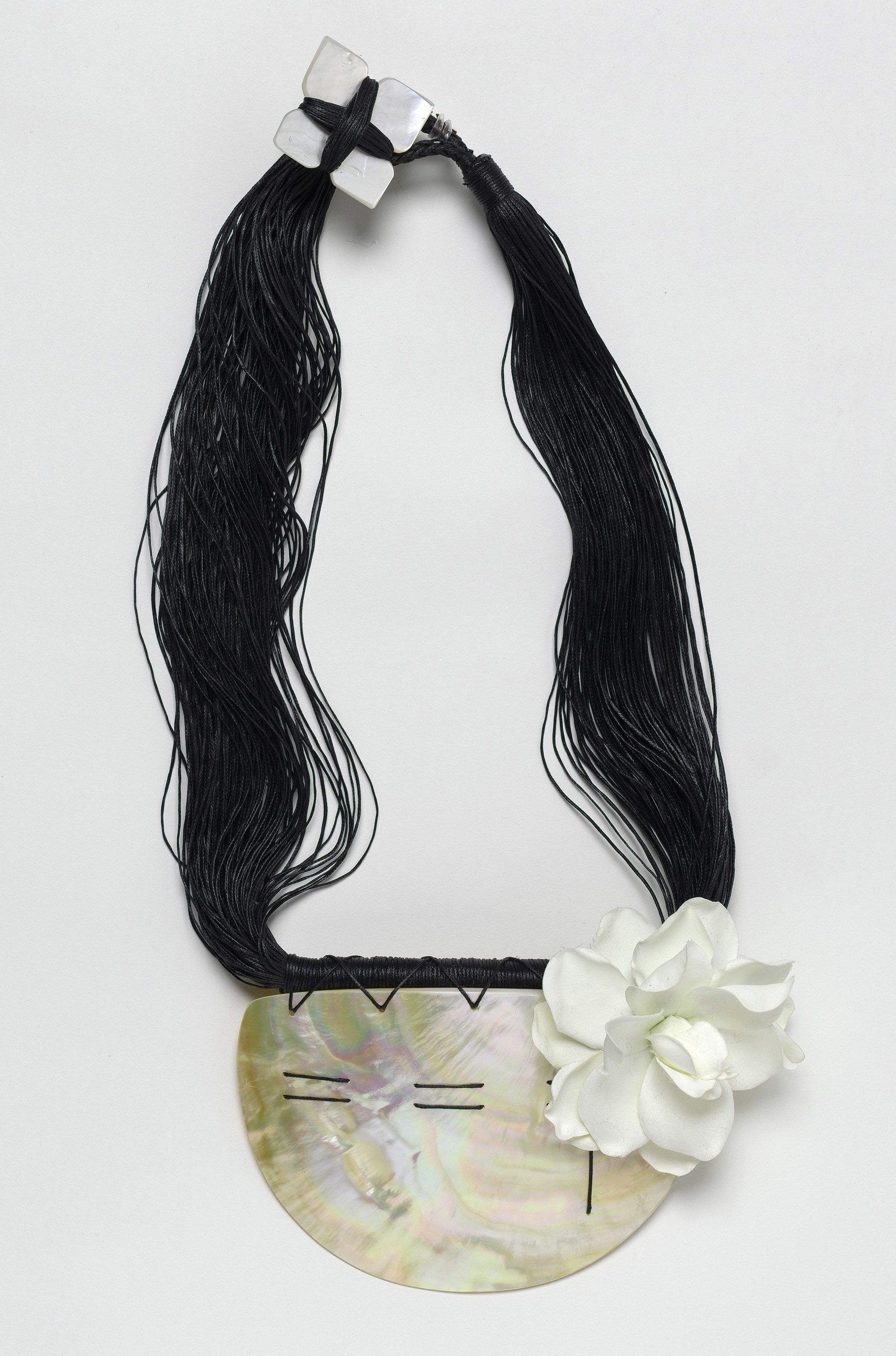 Sofia Tekela-Smith, New Zealand b.1970 / Untitled (from 'Lovely hula hands' series) 2002 / Mother of pearl, rayon flower and waxed thread / 38.5cm (long);breastplate:12.5 x 17 x 5.2cm / Purchased 2002 / Collection: Queensland Art Gallery | Gallery of Modern Art / © Sofia Tekela-Smith