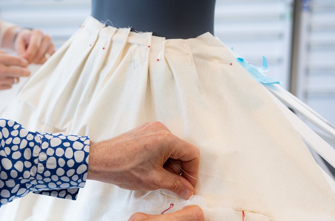 What is a fairy tale without a ball gown? Conservators Michael Marendy and Elizabeth Thompson are weaving their magic behind-the-scenes getting ready for ‘Fairy Tales’.

Conservator Michael Marendy preparing the support for the ‘Cream wedding dress’ designed by Eiko Ishioka for Mirror Mirror (2012) installed in ‘Fairy Tales’, Gallery of Modern Art (GOMA), Brisbane 2023 / Photograph: C Callistemon © QAGOMA