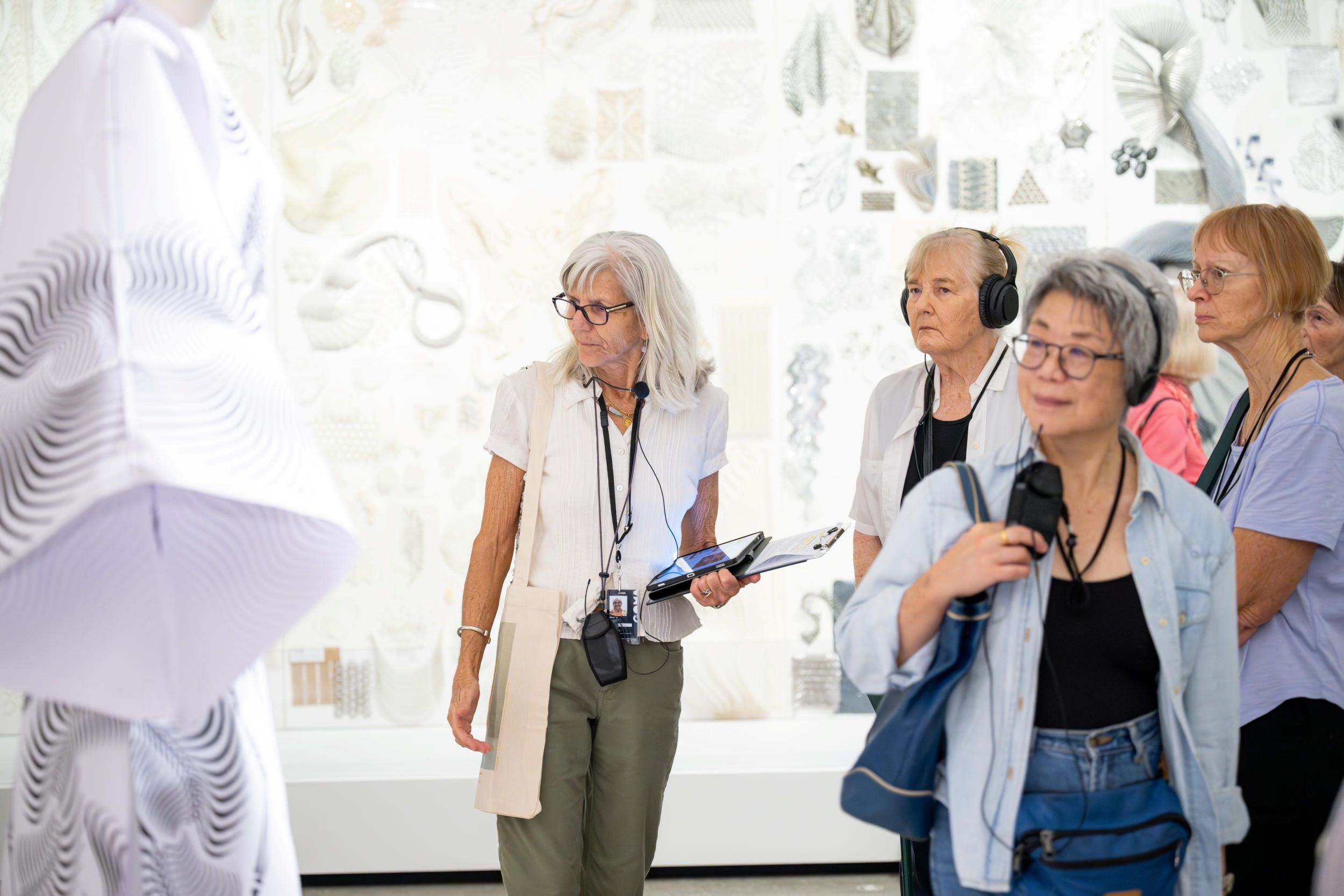 Visitors using assisted listening devices on a guided tour at Gallery of Modern Art | Photograph: C. Callistemon