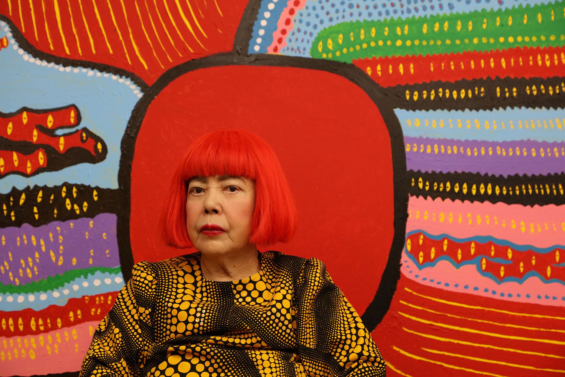 Yayoi Kusama in front of Life is the Heart of a Rainbow 2017 ©YAYOI KUSAMA, Courtesy of Ota Fine Arts, Tokyo/Singapore, Victoria Miro, London, David Zwirner, New York