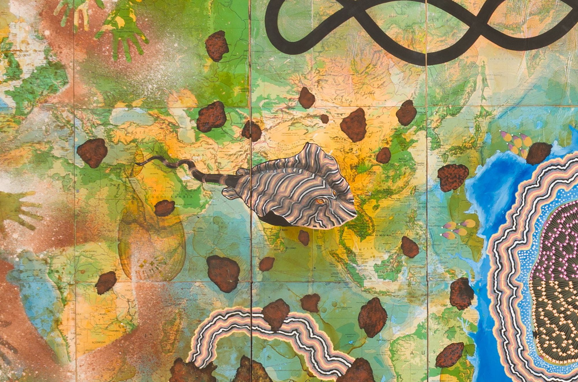 Artist: Michael Eather, Australia b.1963 / Collaborating artists: Joanne Currie Nalingu, Gunggari people, Australia b.1964 / Kumantje Jagamara, Warlpiri/Luritja people, Australia c.1946-2020 / Lin Onus, Yorta Yorta people, Australia 1948-96 / Christopher Hodges, Australia b.1954 / Clifford Possum Tjapaltjarri, Anmatyerre people, Australia c.1932-2002 / Karen Casey, Palawa people, Australia 1956-2021 / Rick Roser, Jinbara people, Australia b.1955 / Simon Turner, Australia b.1972 / Ruby Abbott Napangardi, Luritja people, Australia b.c.1953 / Barbara Weir, Anmatyerre/Alyawarr peoples, Australia b.c.1945 / Laurie Nilsen, Mandandanji people, Australia 1953-2020 / Stephen Gawulku, Kunibidji people, Australia b.unknown / Bianca Beetson, Kabi Kabi (Gubbi Gubbi) people, Australia b.1973 / Two worlds (detail) 1995-97 / Synthetic polymer paint, natural pigments, shellac, photocopied images on 75 boards with velvet curtains and rods 15 panels: 305 x 60cm (each); 300 x 956cm (installed); 2 curtains: 325 x 335cm, 325 x 340cm; 4 curtain rods: 3 x 75cm (each) / Purchased 1997 with funds from an anonymous donor through the QAG Foundation and from a special allocation from the Queensland Government. Celebrating the Queensland Art Gallery's Centenary 1895-1995 / Collection: Queensland Art Gallery | Gallery of Modern Art / © The artists