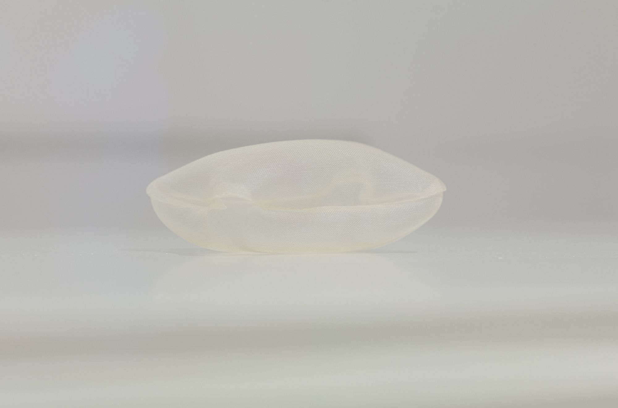 Rei Naito, Japan b.1961 / pillow for the dead 1998 / Silk organza, thread, air on medium density fibreboard painted pedestal with perspex cover / 6.3 x 4.5 x 3cm / Purchased 1999.QAG Foundation Grant / Collection: Queensland Art Gallery | Gallery of Modern Art / © Rei Naito