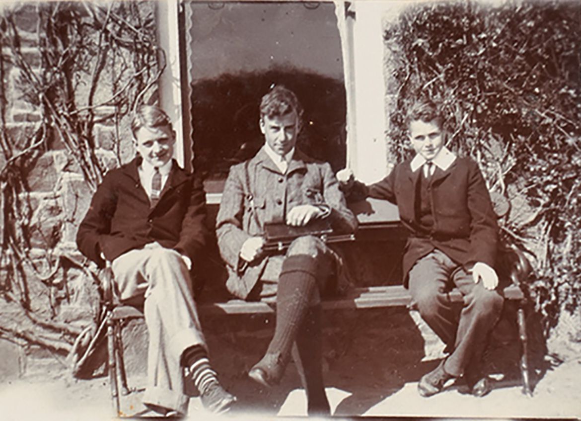 Page from the album of Ethel Fairweather showing photograph of Ian Fairweather (right) with friends and family members / Collection: QAGOMA Research Library / © QAGOMA