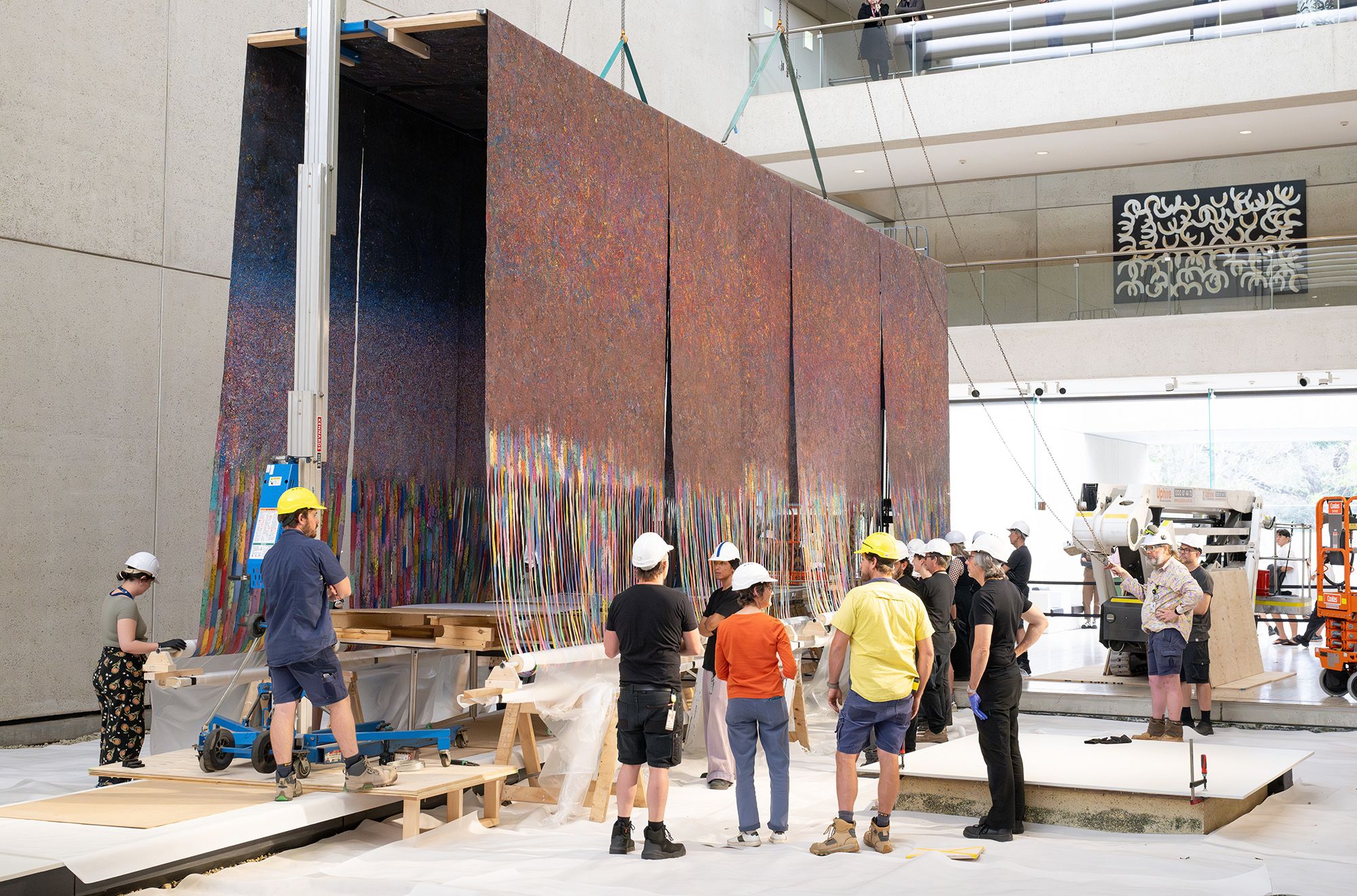 Mit Jai Inn, Thailand b.1960 / Installation of Untitled (Tunnel #APT) 2024 / Oil on canvas / Eight parts: 150 × 1200cm (each, approx.) / Site specific work commissioned for ‘The 11th Asia Pacific Triennial of Contemporary Art’, Queensland Art Gallery Watermall, 2024 / © Mit Jai Inn / Courtesy: The artist and Silverlens, Manila and New York / Photograph: N Umek © QAGOMA