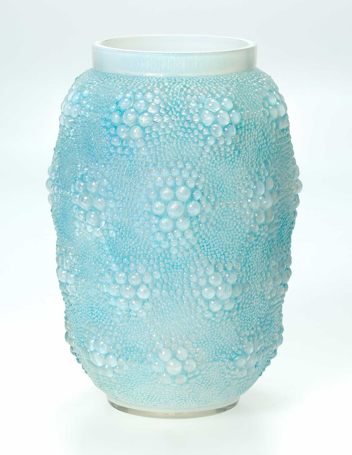 René Lalique, France 1860-1945 / Davos vase designed 1932 / Mould blown opalescent glass with blue patina / 28.5 x 19.5 x 19.5cm / Purchased 2018 with funds from the Estate of Jessica Ellis through the QAGOMA Foundation / Collection: Queensland Art Gallery | Gallery of Modern Art