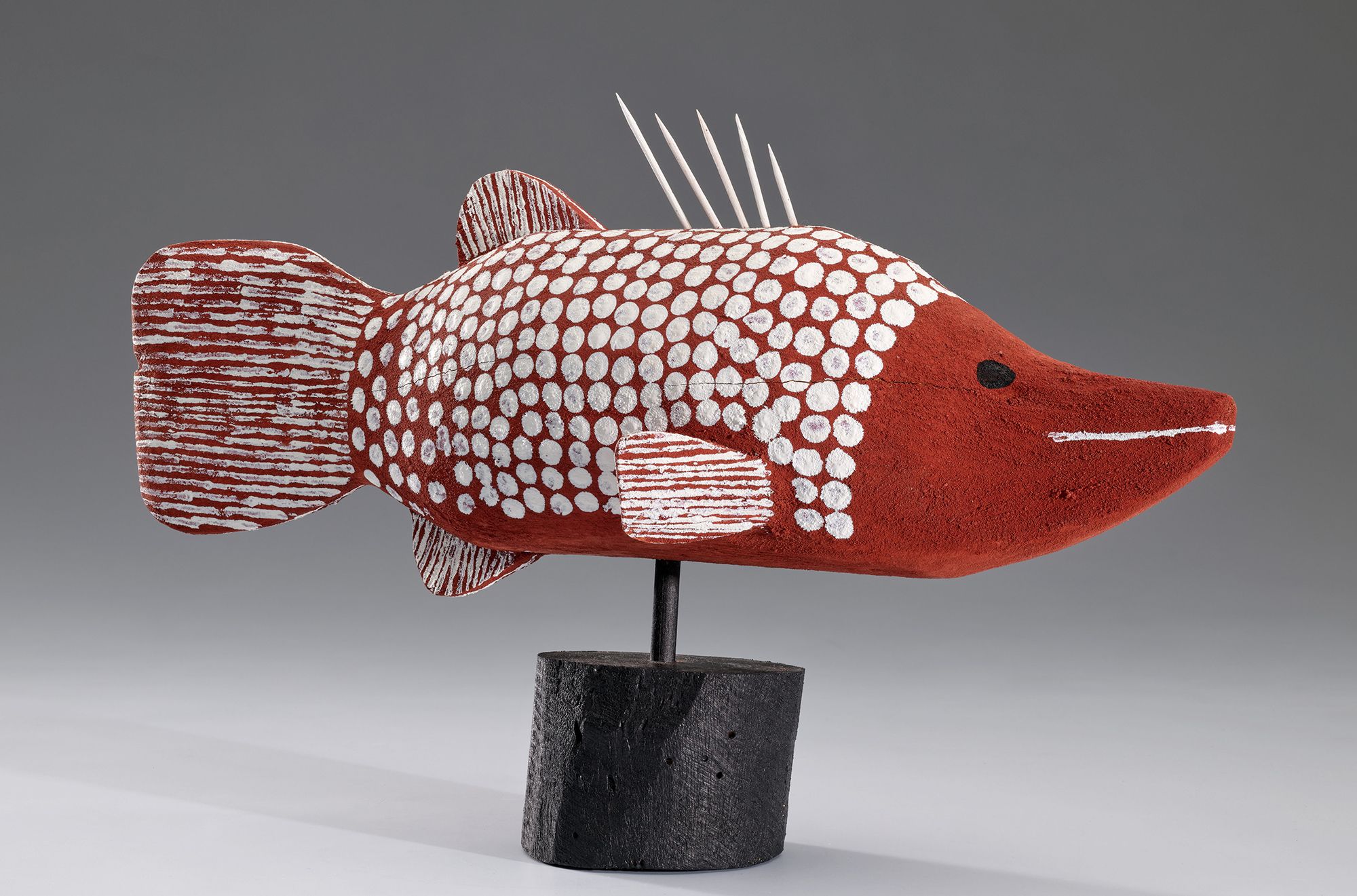Craig Koomeeta, Wik-Alkan people, Australia b.1977 / Wuungkun (Barramundi in Apelech design) 2004 / Carved milkwood with synthetic polymer paint and natural pigments / 24.5 x 44 x 12cm (including stand) / Purchased 2004 / Collection: Queensland Art Gallery | Gallery of Modern Art / © Craig Koomeeta
