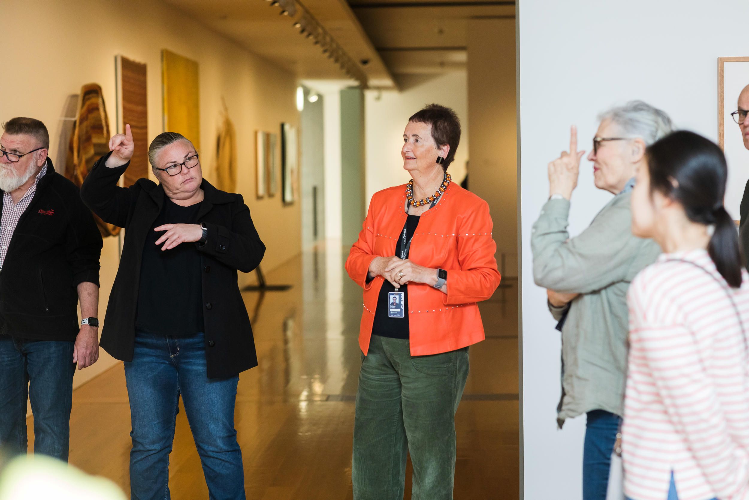 An Auslan interpreter accompanies a volunteer guide on a tour for d/Deaf visitors at the Gallery of Modern Art. Photograph: K. Bennett