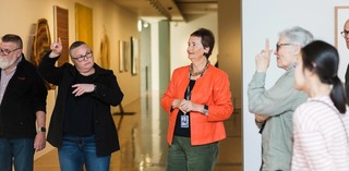 An Auslan interpreter accompanies a volunteer guide on a tour for d/Deaf visitors at the Gallery of Modern Art. Photograph: K. Bennett