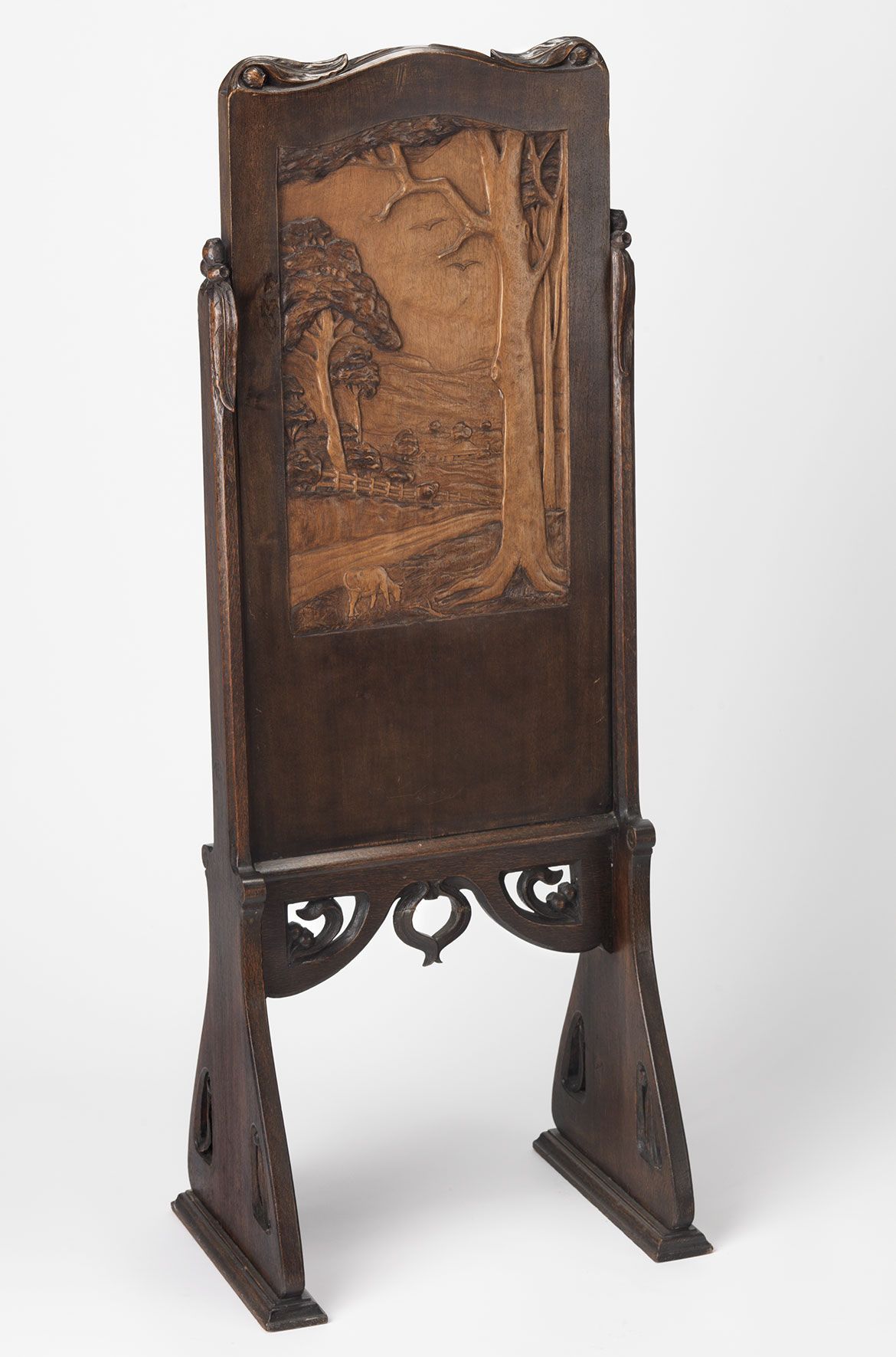 LJ Harvey, Australia 1871-1949 / (Screen with kookaburras and landscape) 1931 / Carved Queensland beech panel with supports in silky oak / 108.5 x 42.8 x 30.5cm / Purchased 1988 with the assistance of the Reverends David and Bruce Noble / Collection: Queensland Art Gallery | Gallery of Modern Art