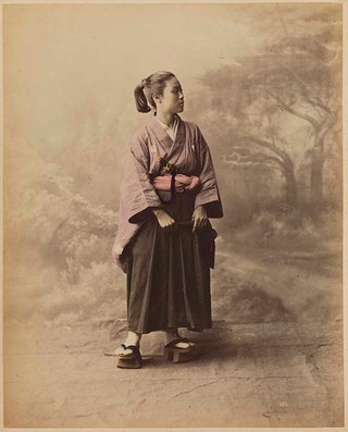 STILLFRIED-RATENICZ, Baron Raimund von Japan b.1839 d.1911 (Young lady wearing hakama kimono) (from ‘Japan’ album) mid 1870s Hand-coloured albumen photograph on board (originally bound in an album) 29.8 x 23.5cm 24.3 x 19.6cm (comp.) Acc. 2010.147.004b Purchased 2010 with funds from the Henry and Amanda Bartlett Trust through the Queensland Art Gallery Foundation