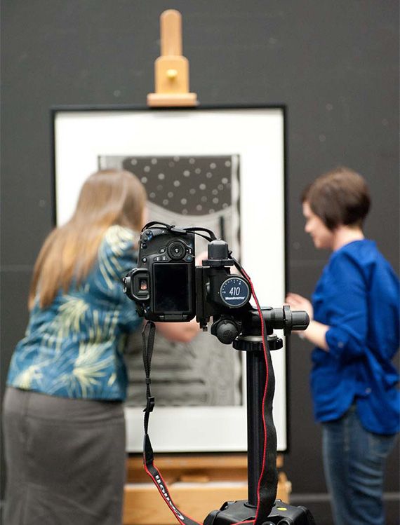 Natasha Harth, Photographer at GoMA, guides Alicia Stevenson, Exhibitions Assistant Artspace Mackay, whilst visiting the GoMA Photography studio on a regional internship