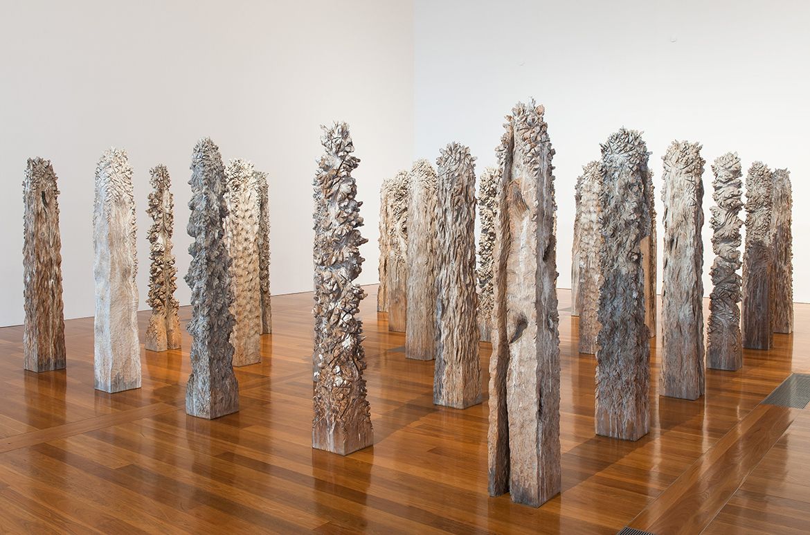 Shigeo Toya, Japan b.1947 / Woods III 1991–92 / Wood, ashes and synthetic polymer paint / 30 pieces: 220 x 30 x 30cm (each, irreg., approx.); 220 x 530 x 430cm (installed) / The Kenneth and Yasuko Myer Collection of Contemporary Asian Art. Purchased 1994 with funds from The Myer Foundation and Michael Sidney Myer through the QAG Foundation and with the assistance of the International Exhibitions Program / Collection: Queensland Art Gallery | Gallery of Modern Art / © Shigeo Toya