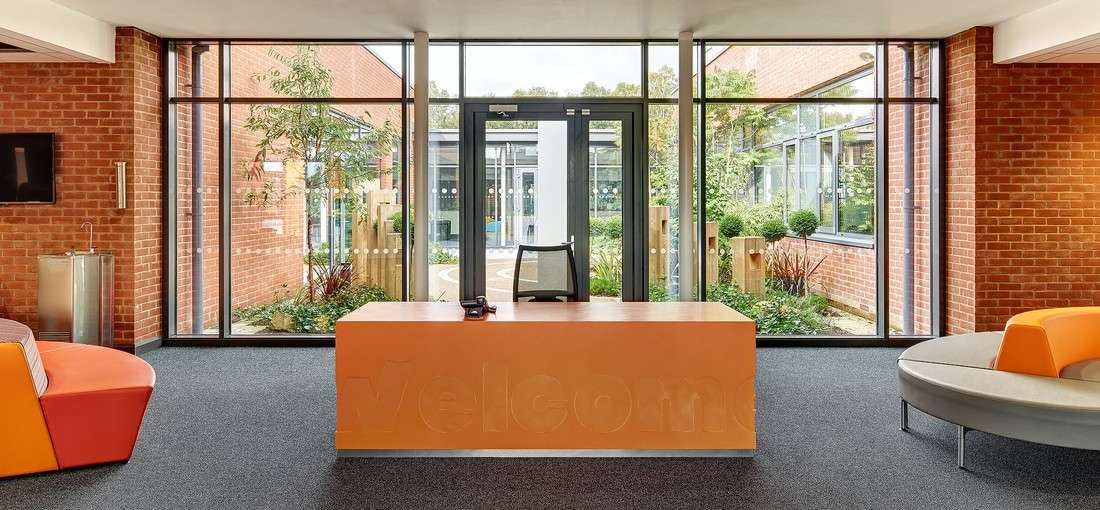 Oranjerood bricks interior exterior brick facade at Arvalee school