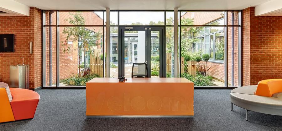 Oranjerood bricks interior exterior brick facade at Arvalee school