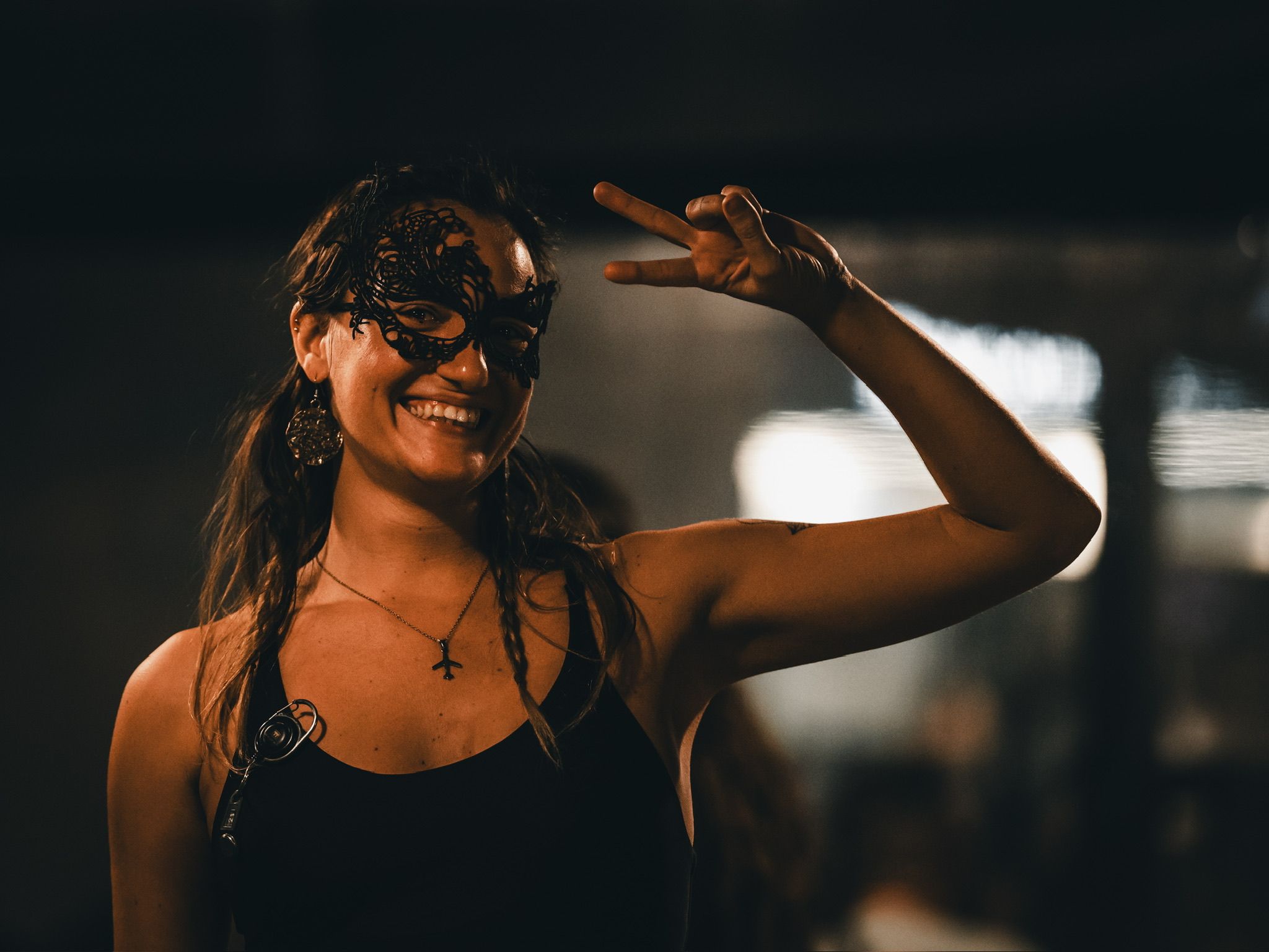 Person giving a peace sign.