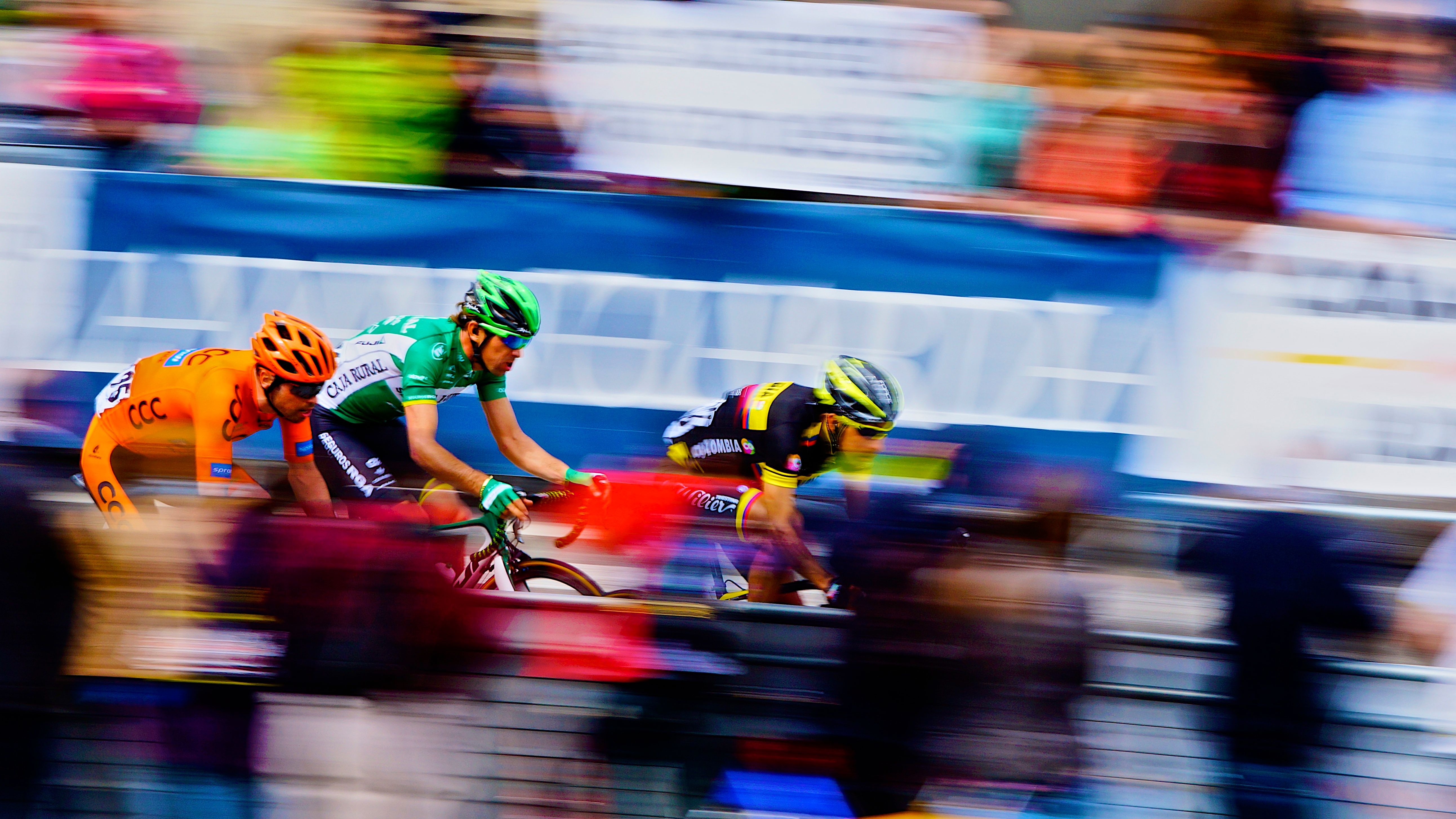 3 other cyclists sprinting 