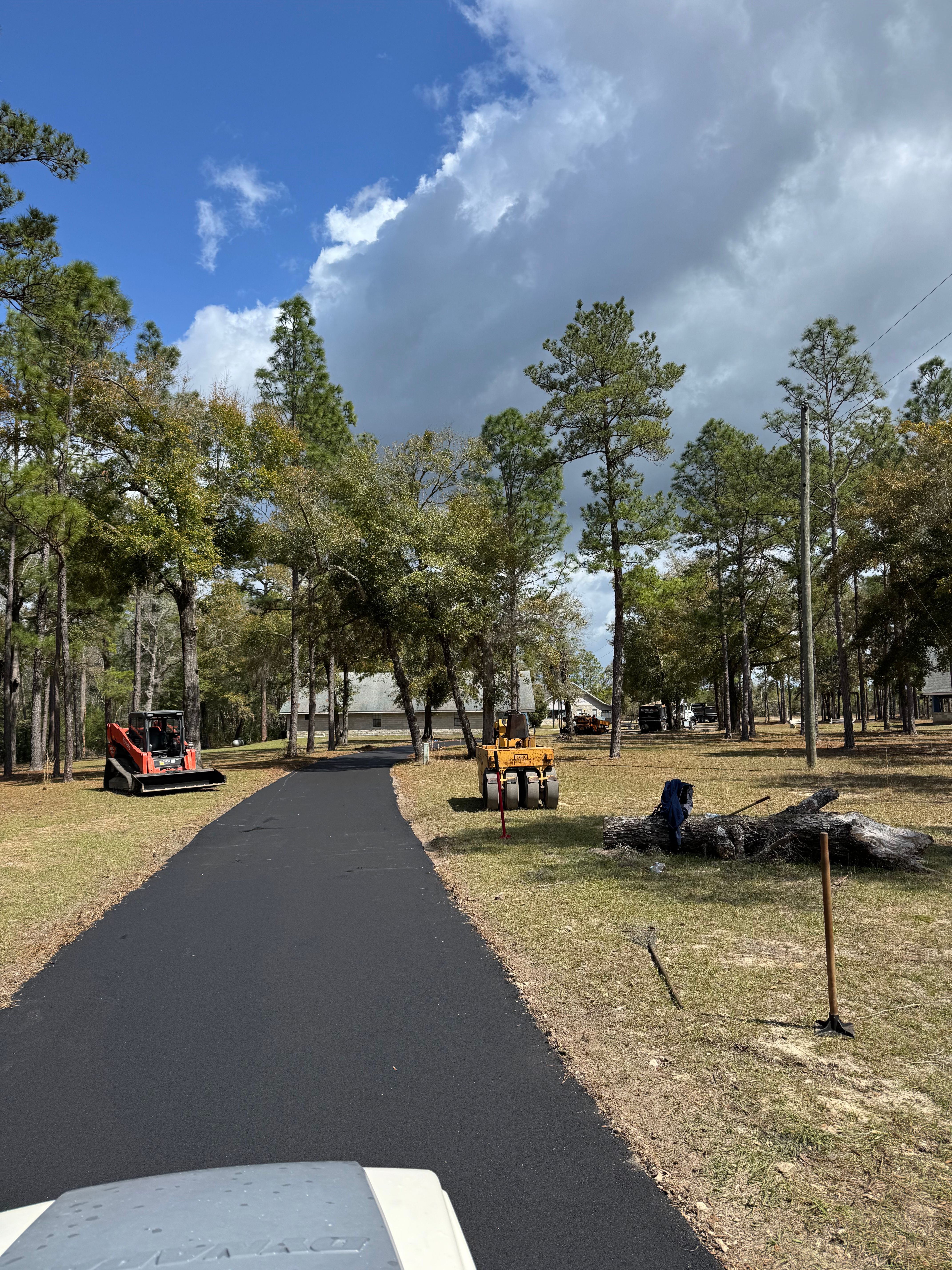 Paving equipment on a newly surfaced private driveway