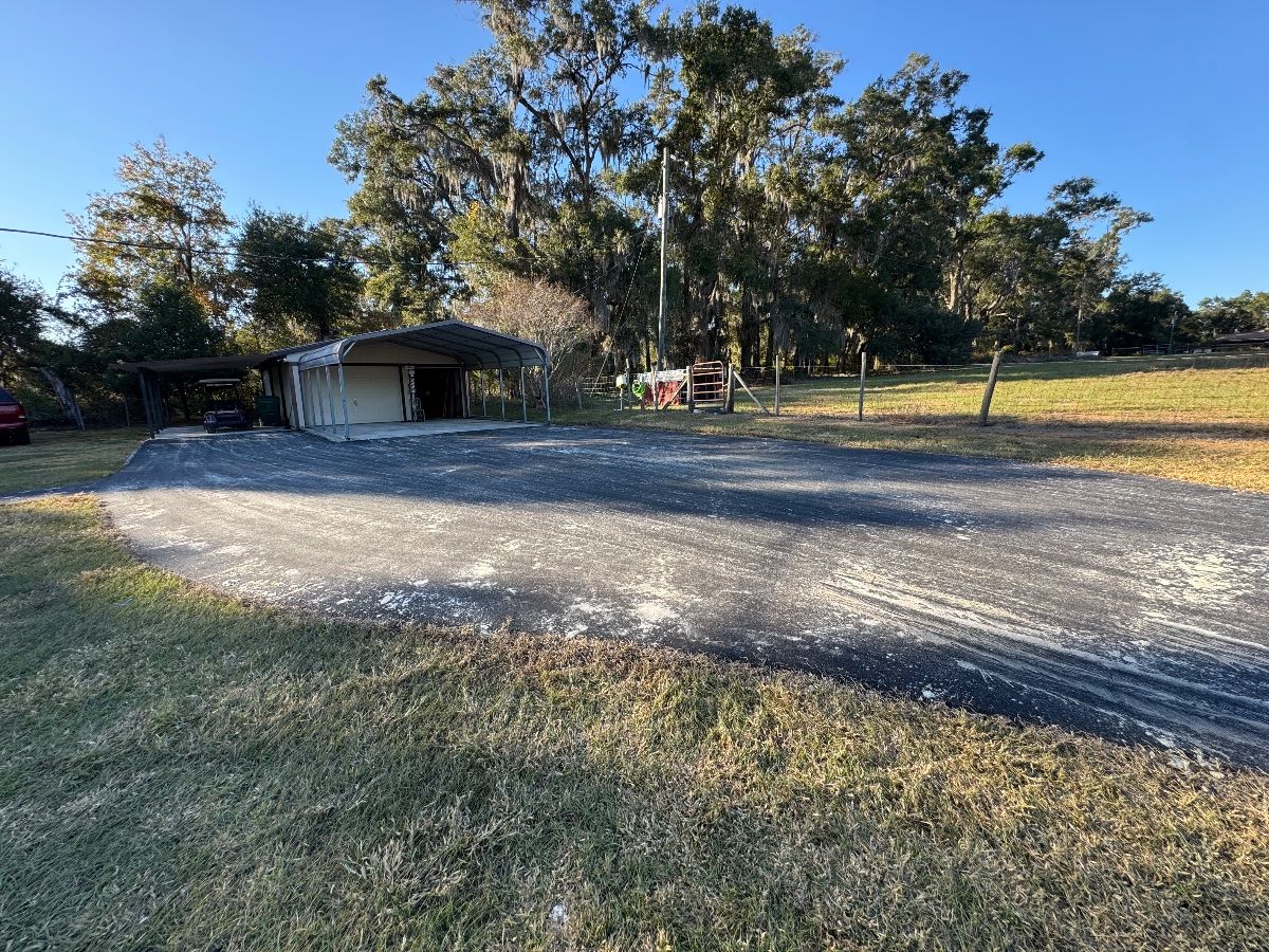 New asphalt driveway with existing car-port
