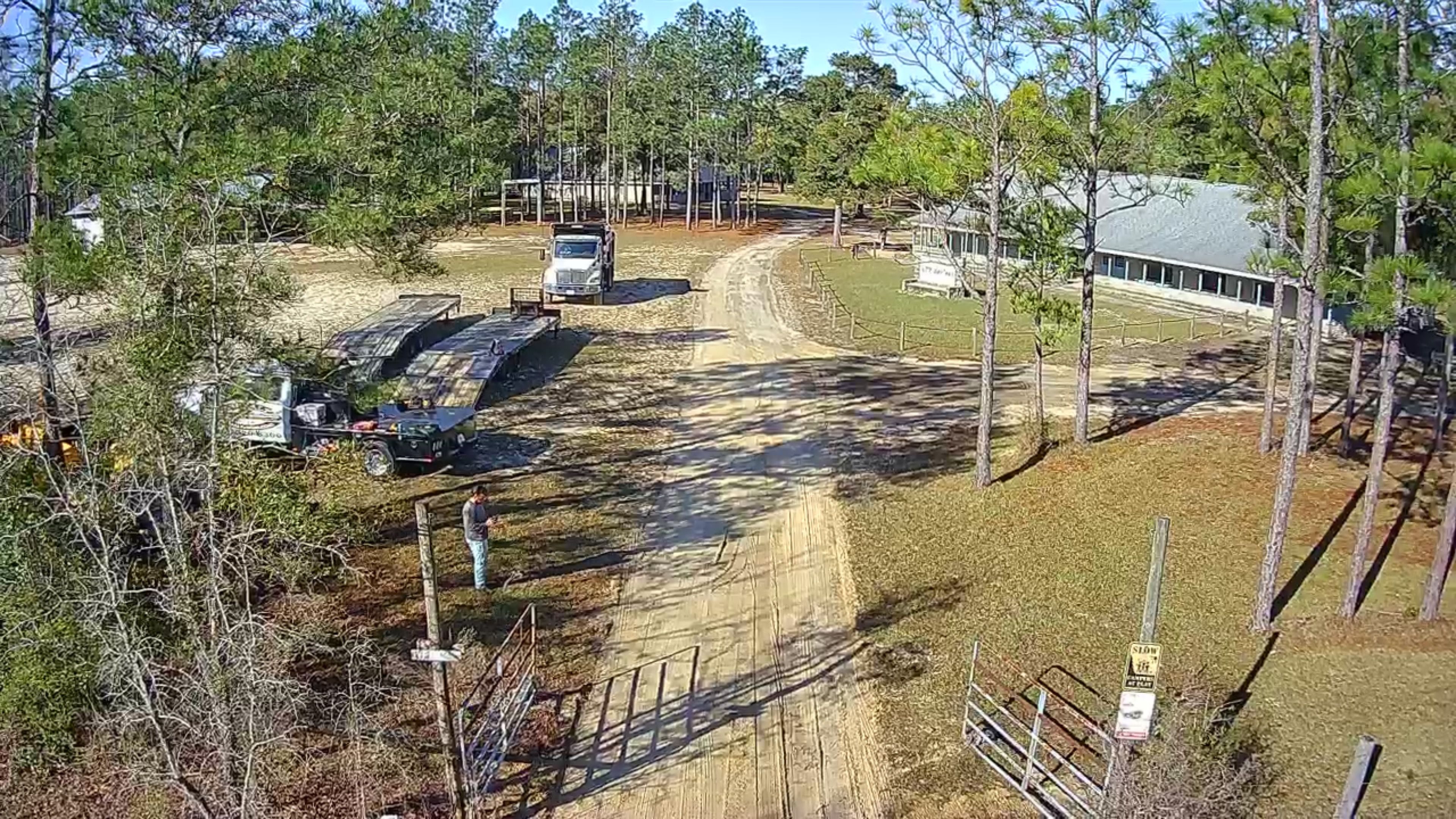Aerial view of a long private driveway before paving