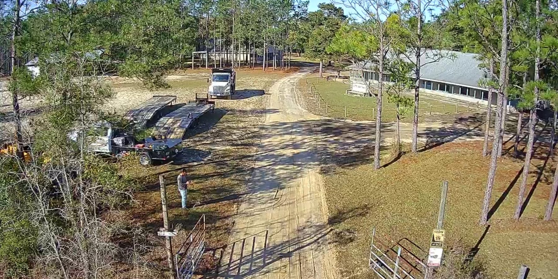 Aerial view of a long private driveway before paving