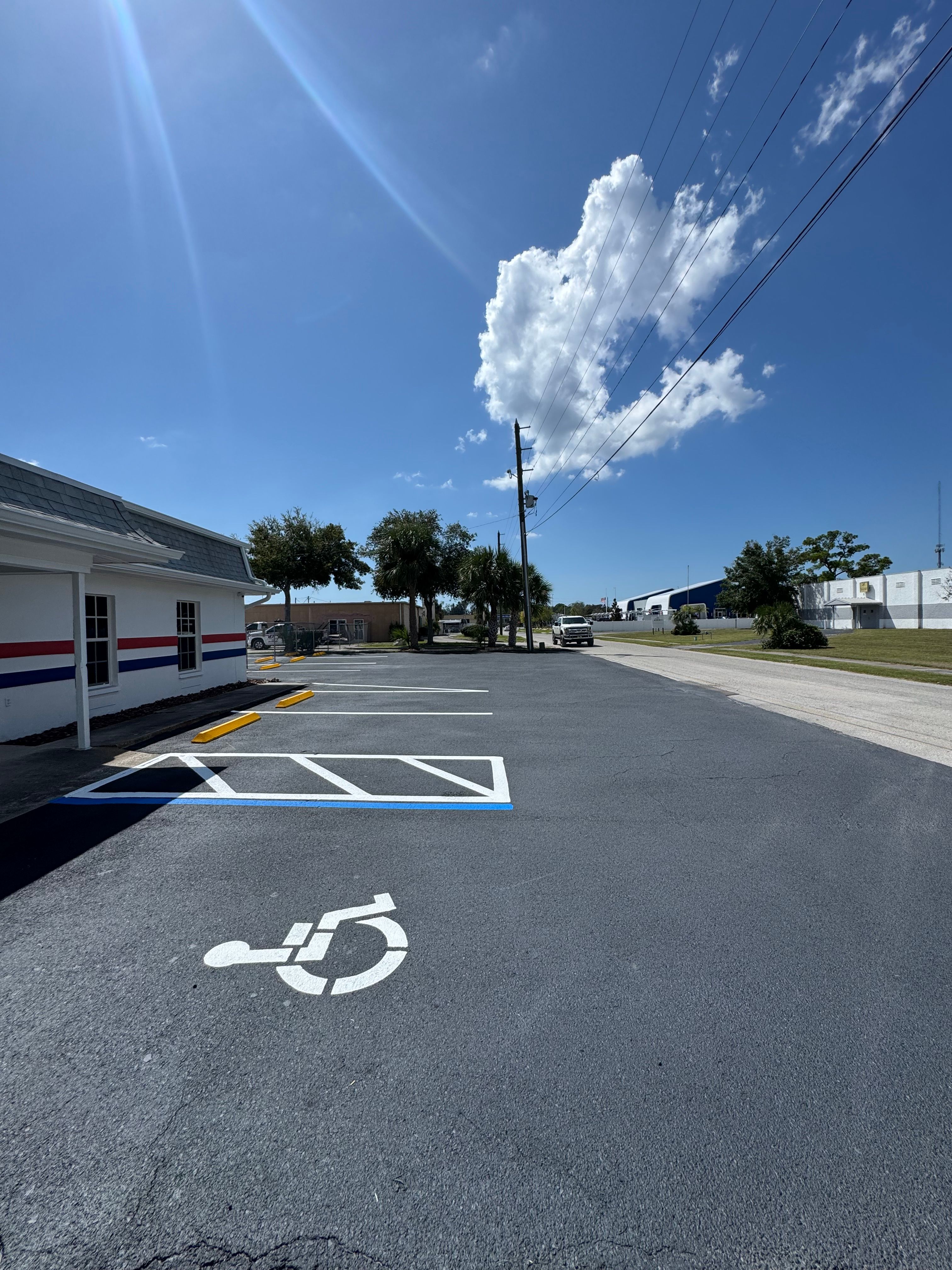 Fresh accessible parking symbol and access-aisle markings