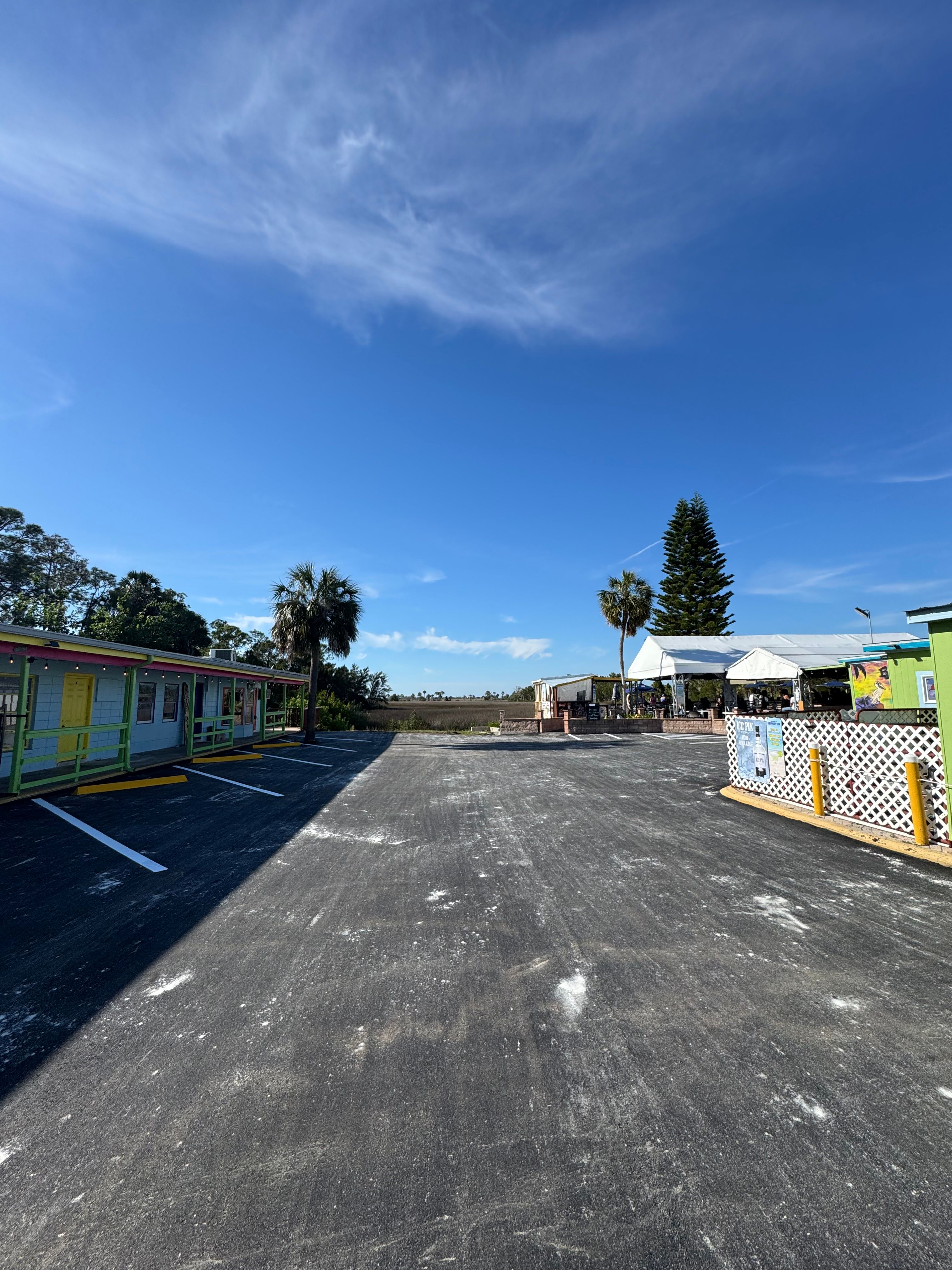 Completed commercial asphalt lot with fresh parking markings