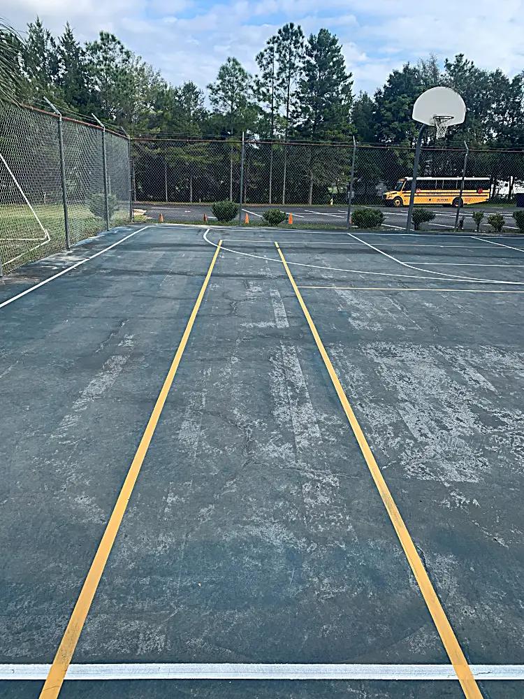 Basketball court before resurfacing