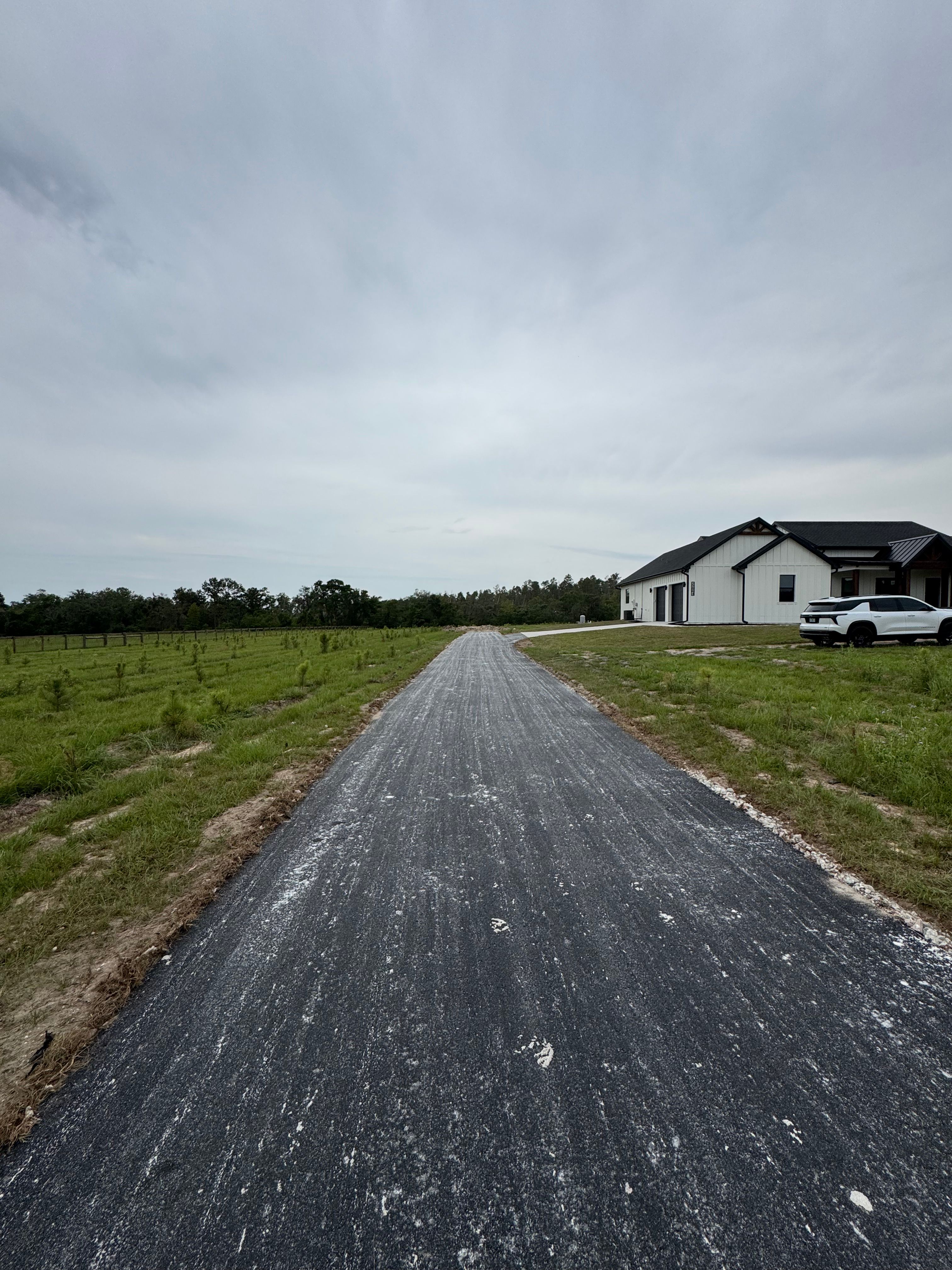 Driveway installation and asphalt millings — view 1