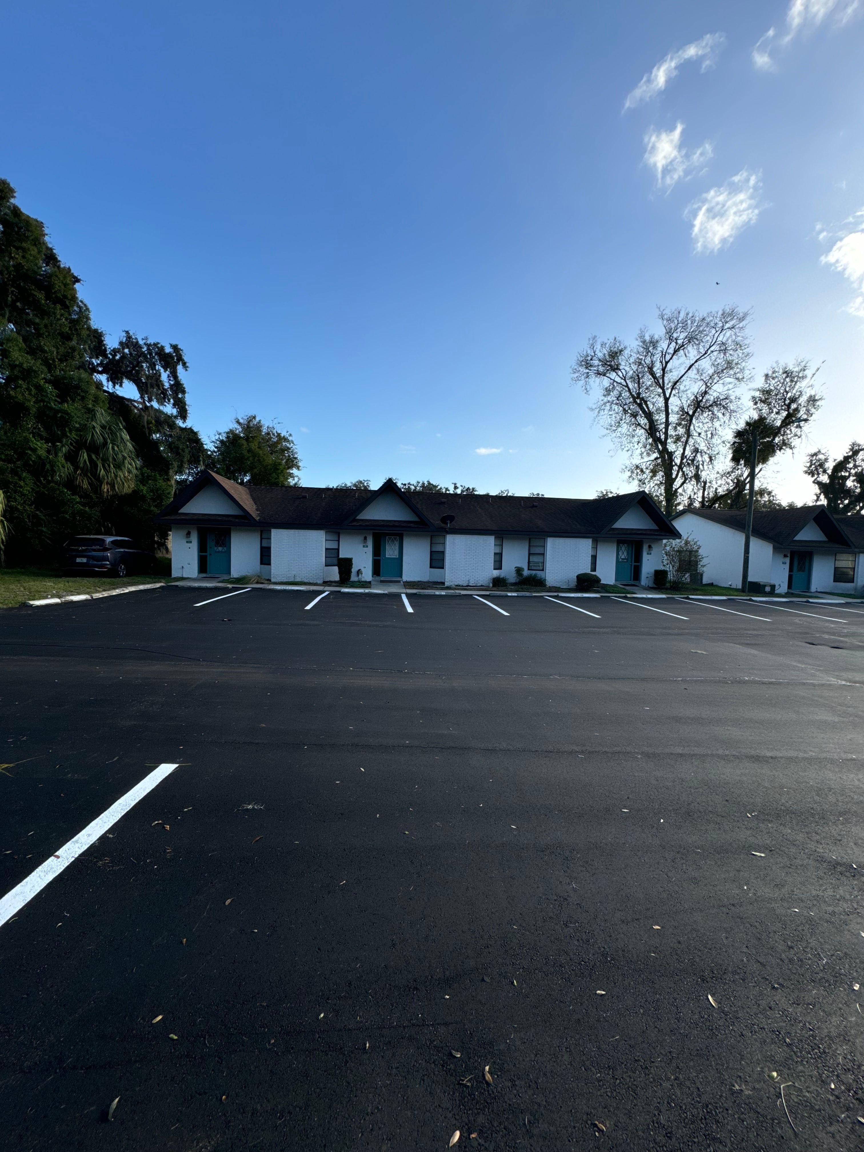 Finished asphalt roadway through a managed property
