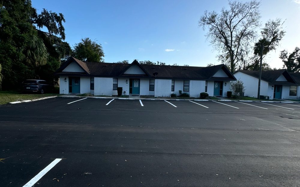 Finished asphalt roadway through a managed property