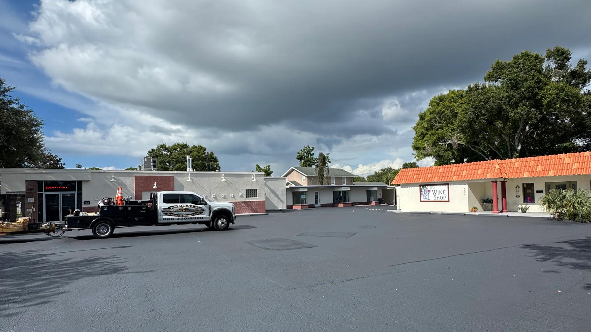 Completed asphalt surface across a commercial parking lot