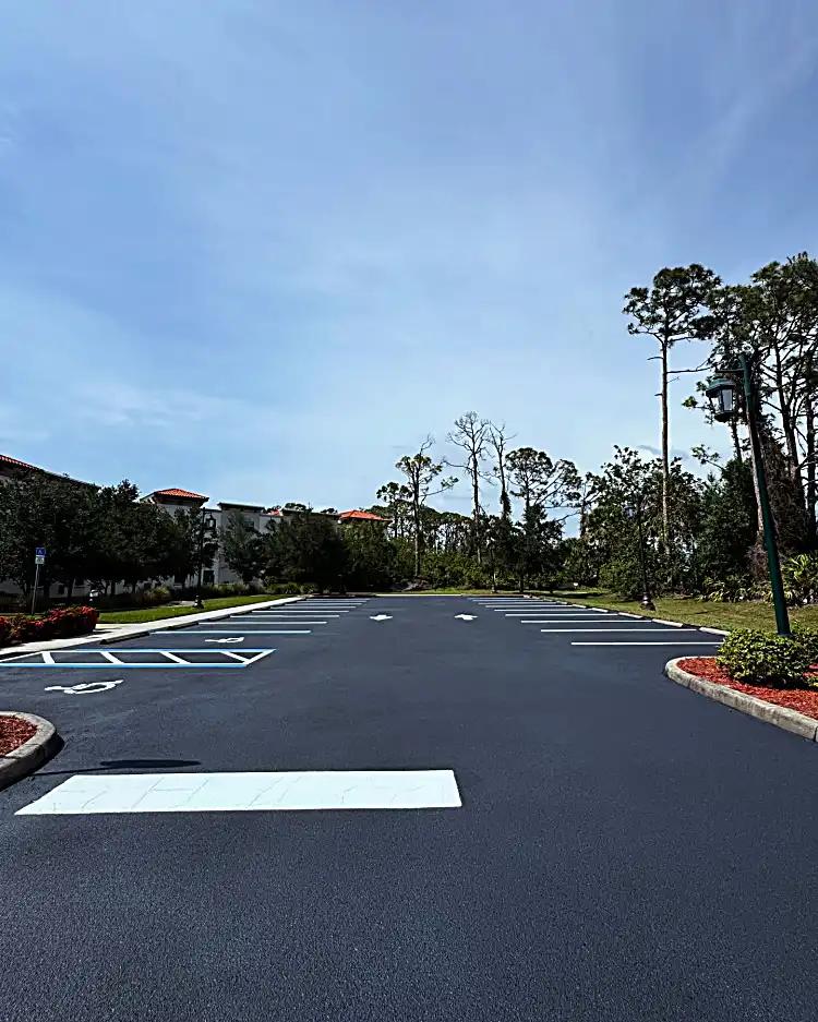 Discovery Commons South Biscayne parking area with dark sealcoat and fresh white and blue markings