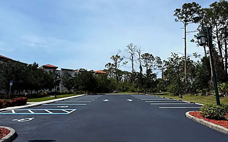 Discovery Commons South Biscayne parking area with dark sealcoat and fresh white and blue markings