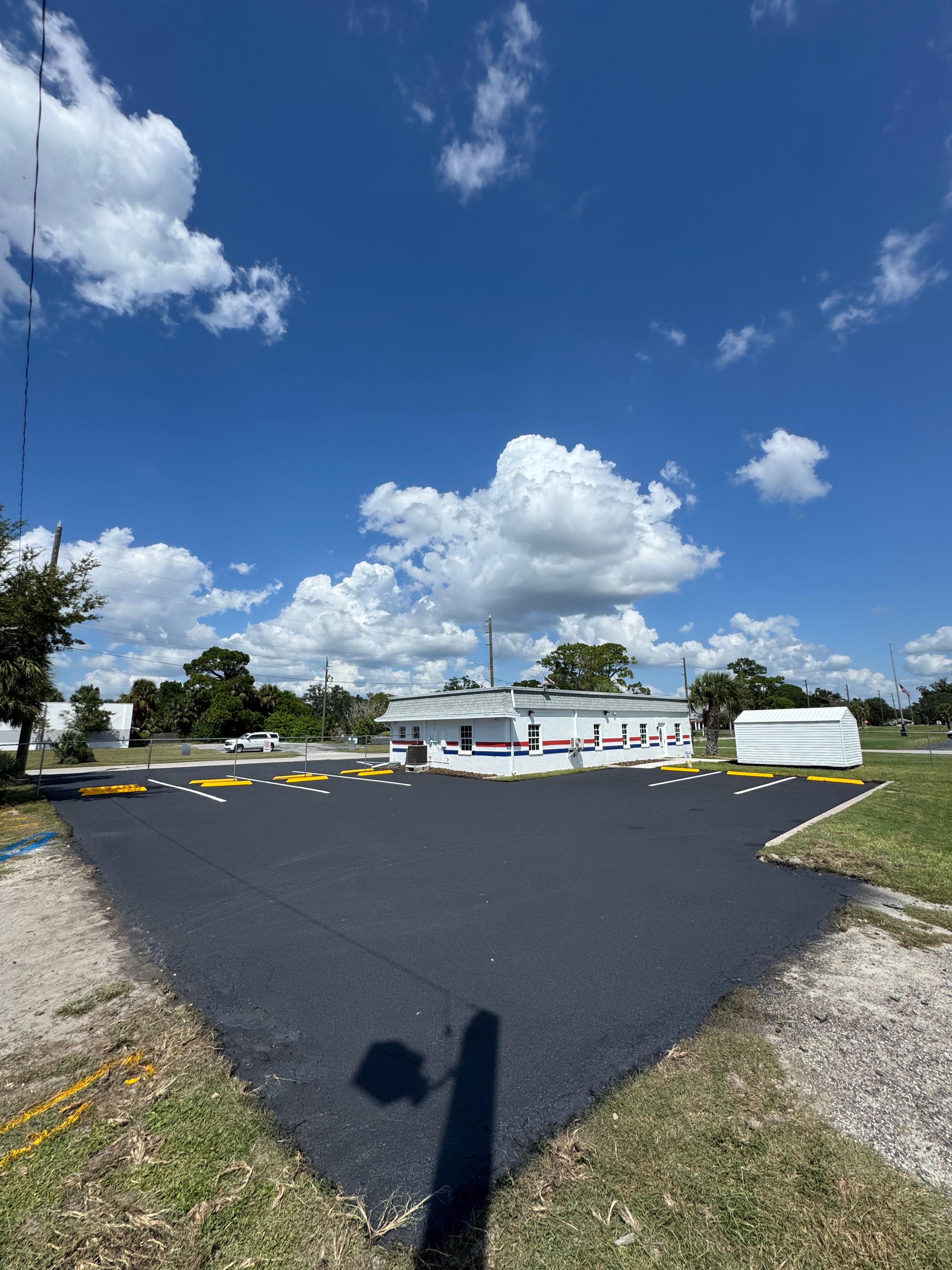 Completed commercial lot with fresh markings and wheel stops