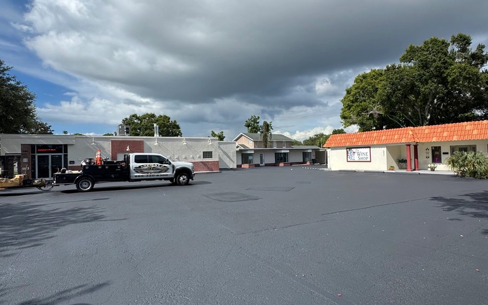Completed asphalt and parking layout at a commercial plaza