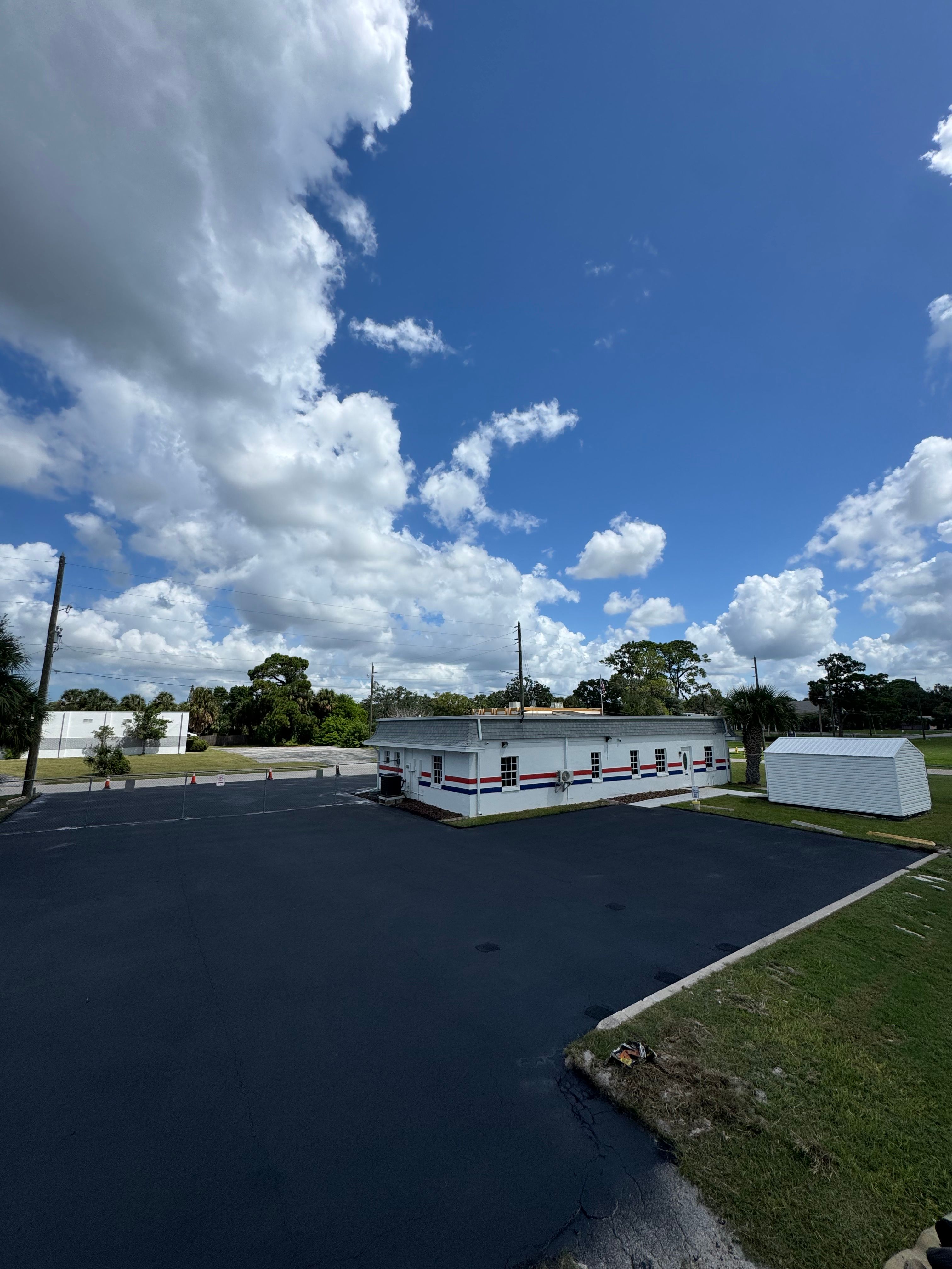 Dark sealed asphalt surface at a commercial property