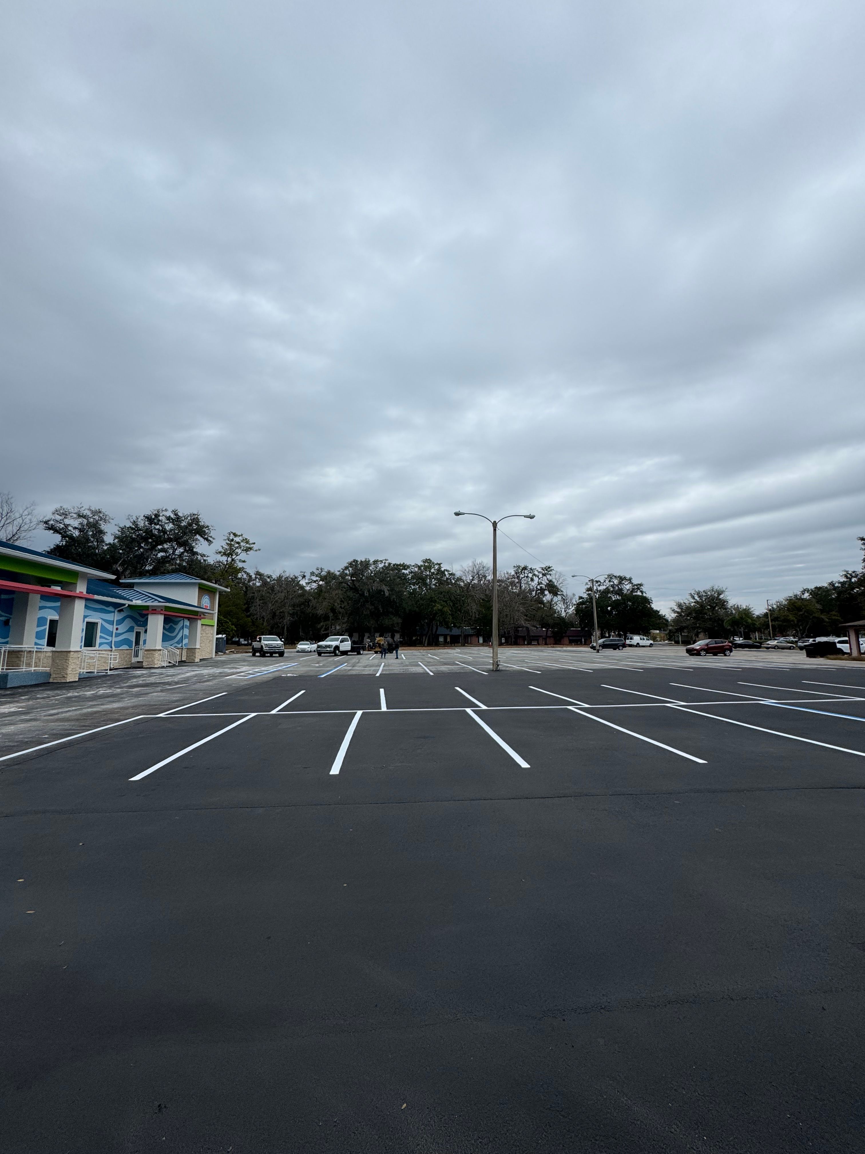 Completed parking layout across a commercial asphalt lot