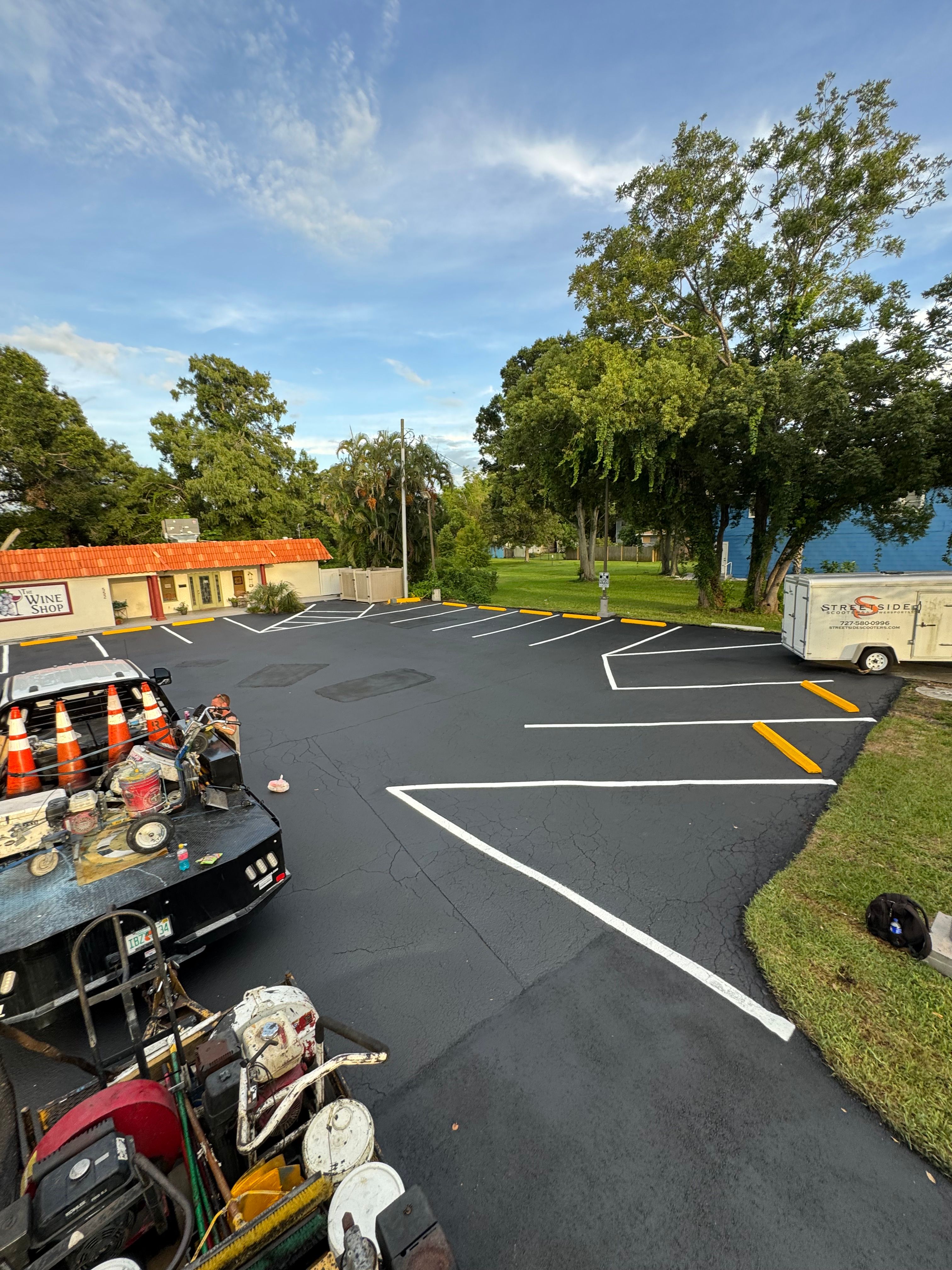 Fresh white and yellow pavement markings on a commercial lot