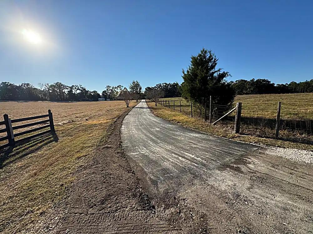 Smooth transition from Dirt-and-gravel to new asphalt driveway