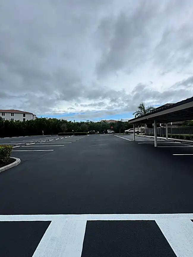 Covered carport with fresh sealcoating