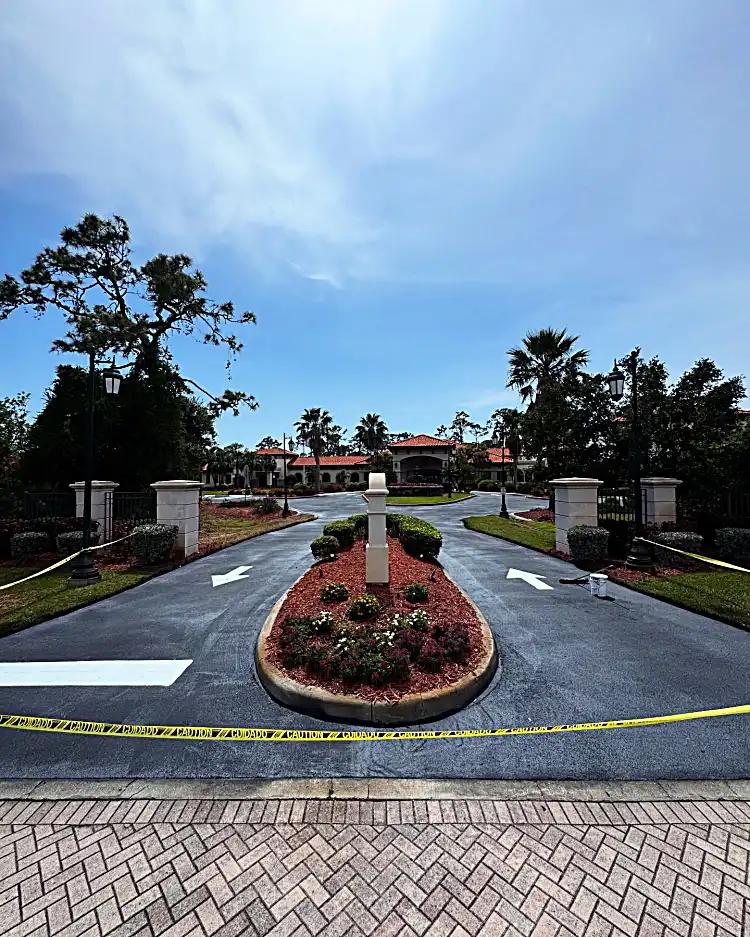 Gated entrance with landscaping islands